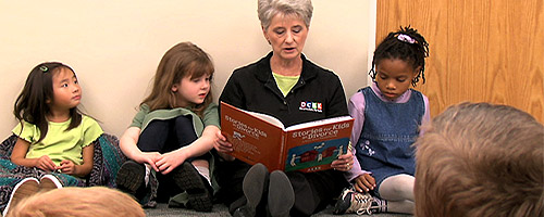 Leader reading to kids
